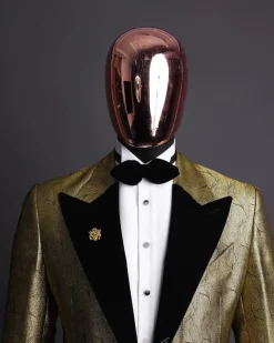 A gold metallic jacquard peak lapel tuxedo suit