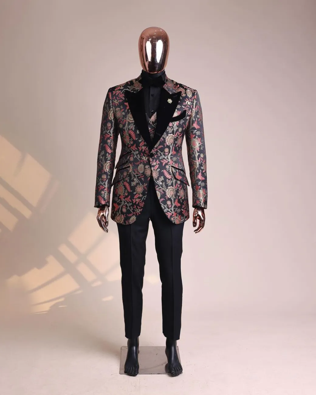 A Gold, peach and black mix metallic jacquard, peak lapel tuxedo suit