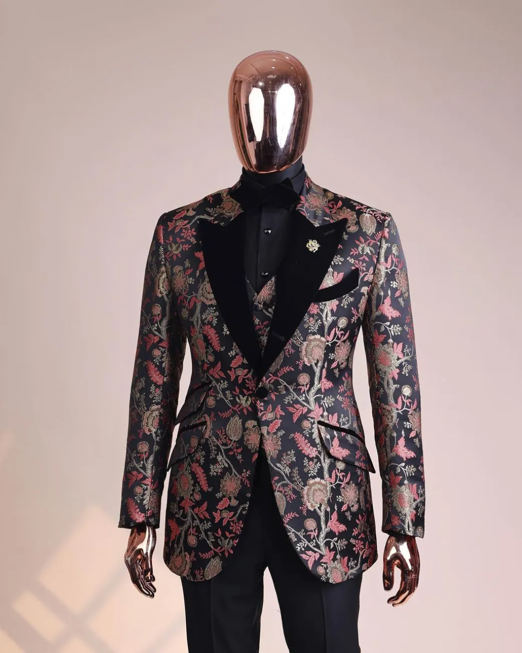 A Gold, peach and black mix metallic jacquard, peak lapel tuxedo suit