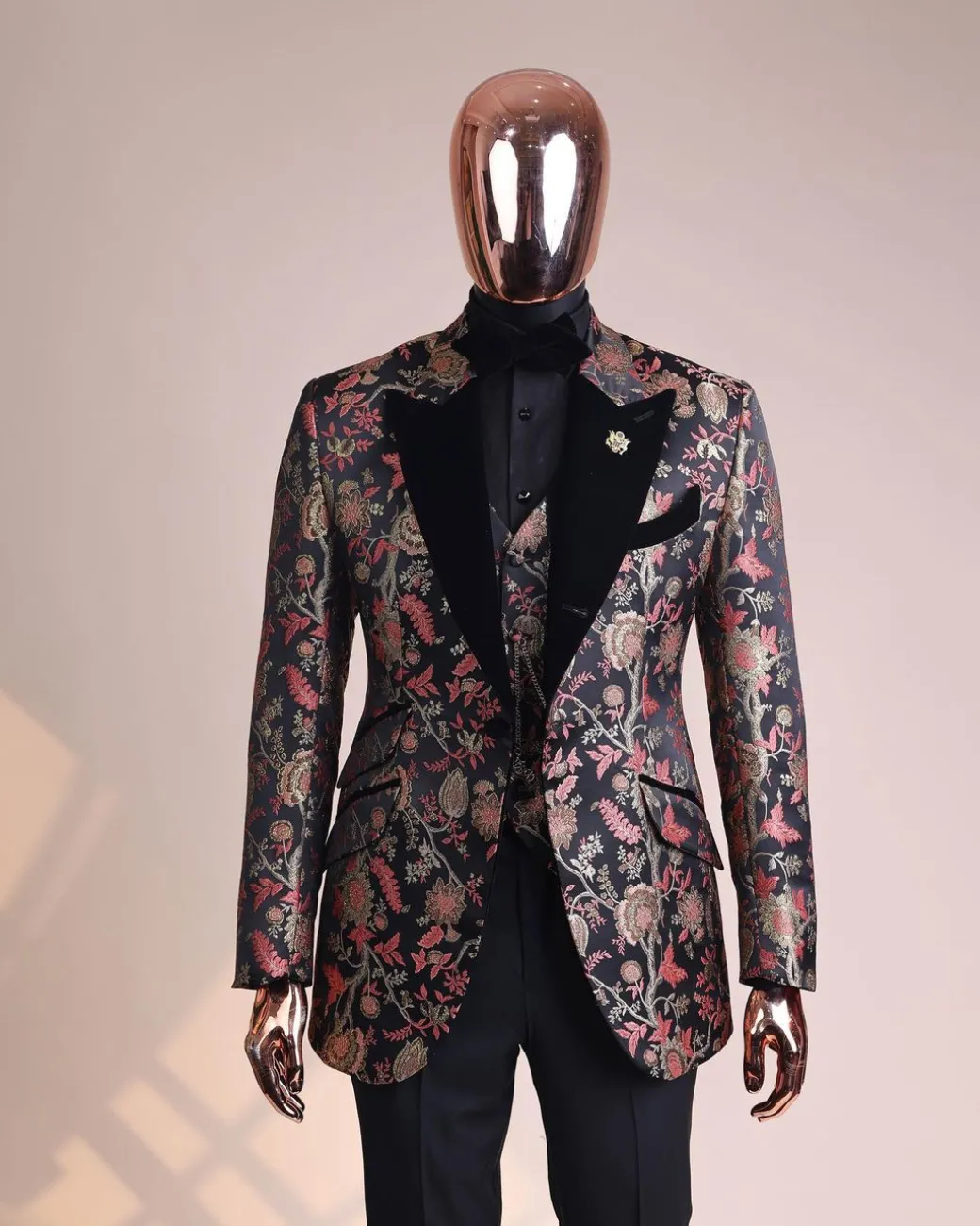 A Gold, peach and black mix metallic jacquard, peak lapel tuxedo suit