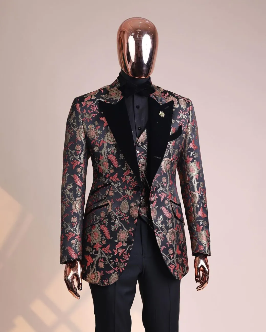A Gold, peach and black mix metallic jacquard, peak lapel tuxedo suit
