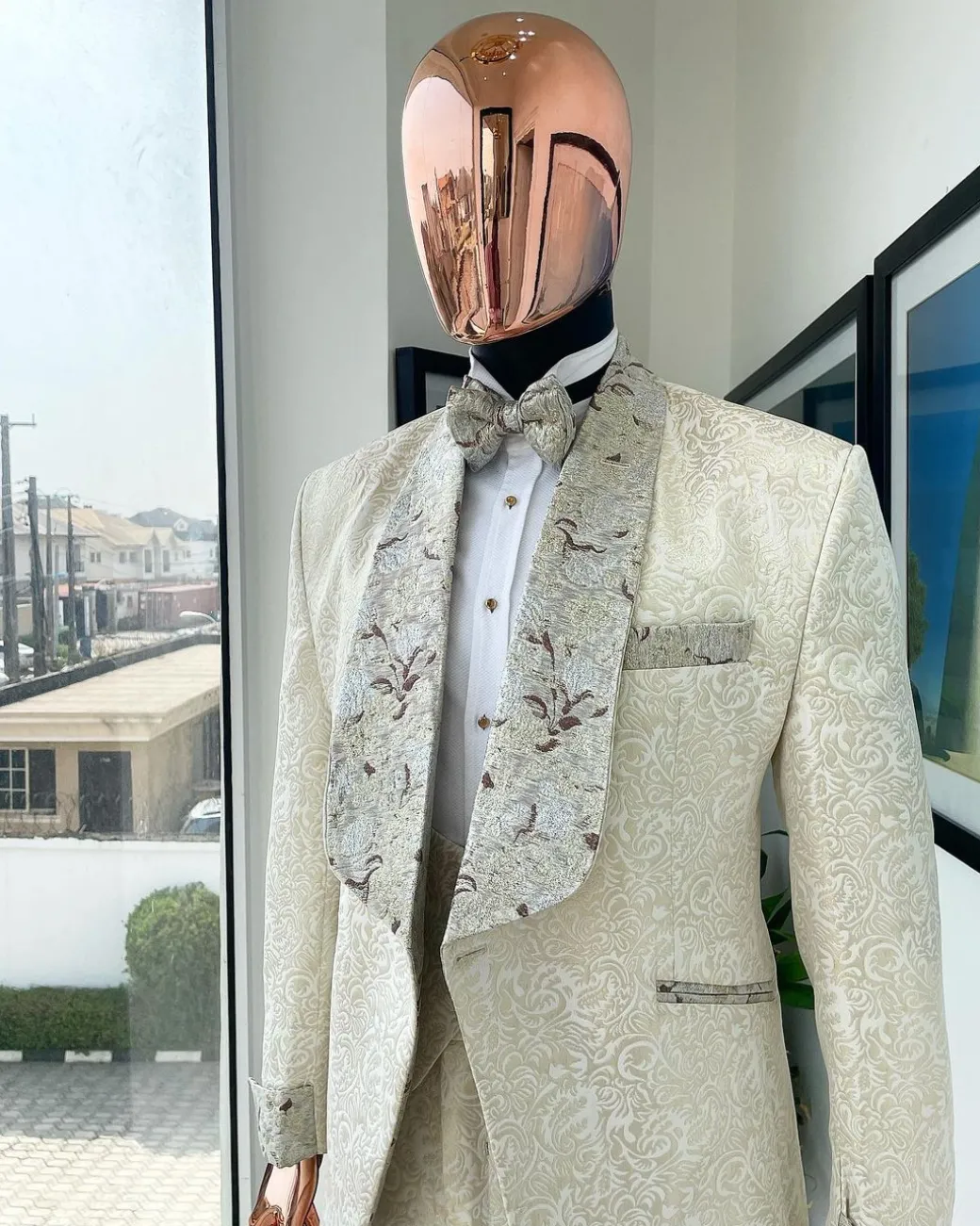 A gold print pattern tuxedo suit, contemplation cream with maroon, champagne gold floral metallic jacquard shawl lapel