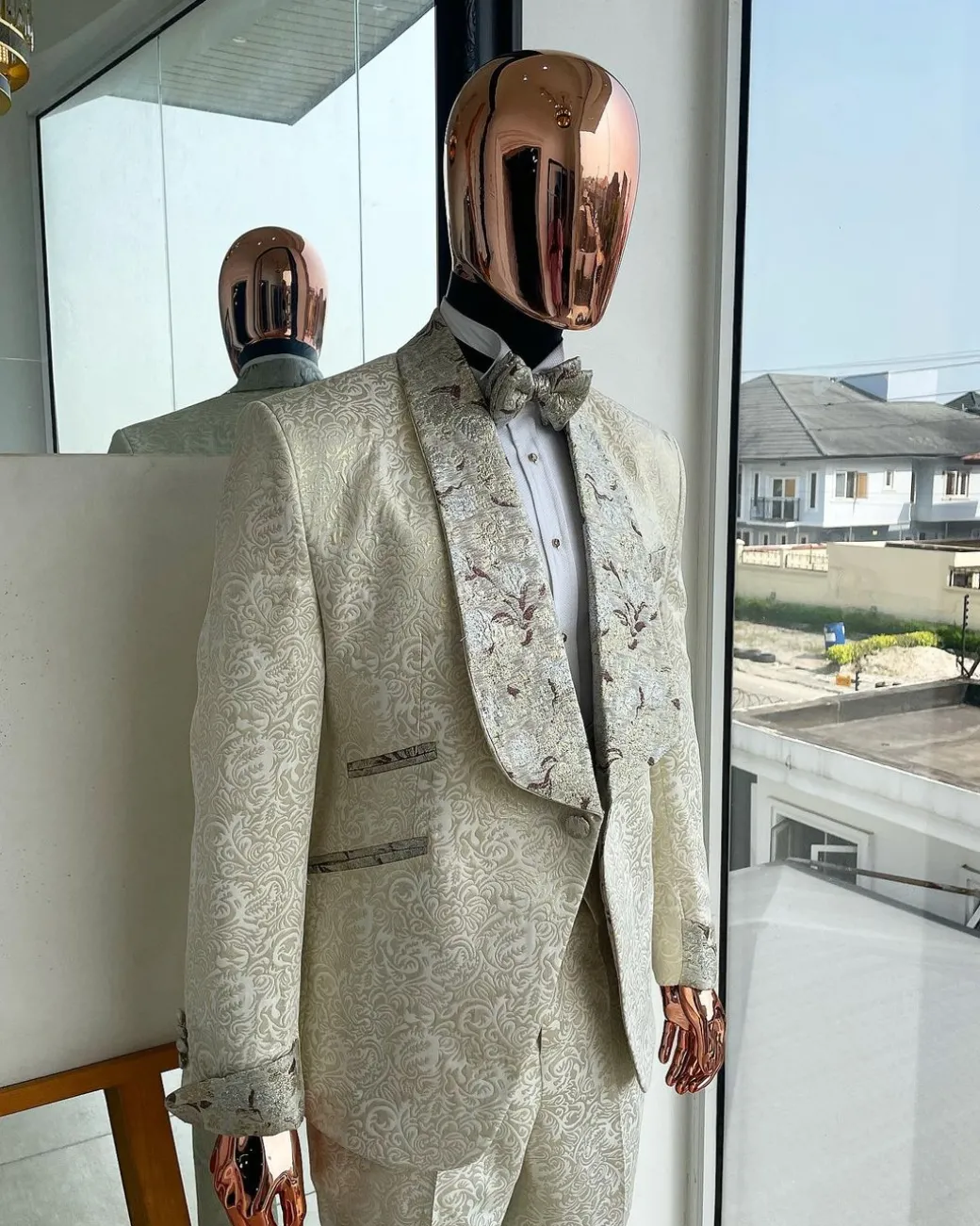 A gold print pattern tuxedo suit, contemplation cream with maroon, champagne gold floral metallic jacquard shawl lapel