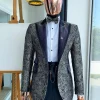 A grey floral jacquard peak lapel with black silk taping tuxedo suit