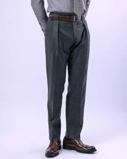 A Grey Gurkha pant with a covered belt tab and double pleats.