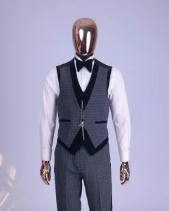 A grey octagonal patterned, navy blue mix, wide notch lapel, single button suit
