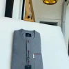 A grey, patch pocket and front flap with a clear view lipstick red Swarovski African kaftan