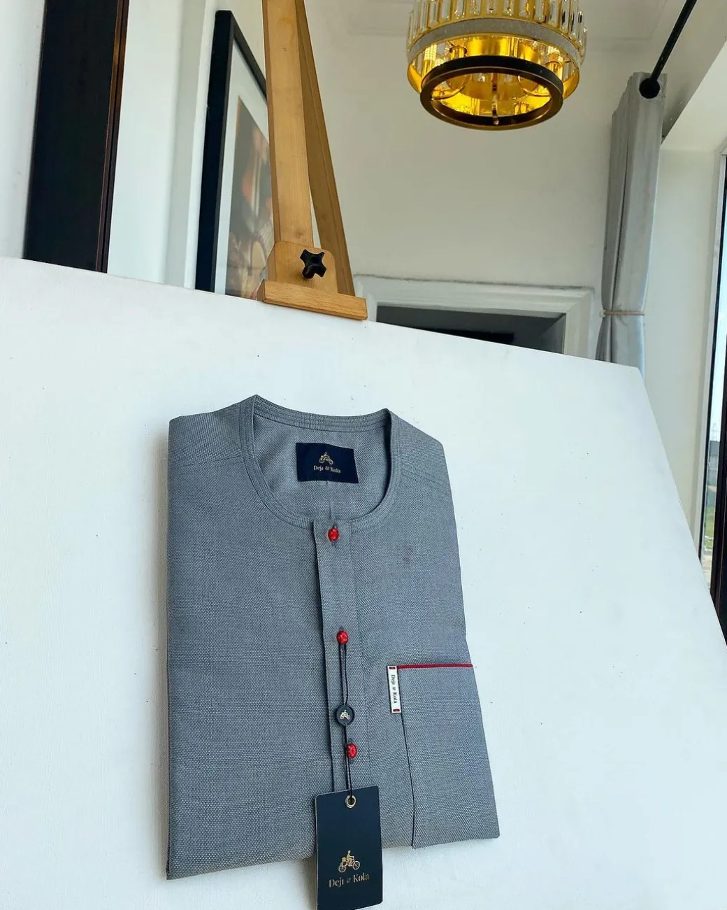 A grey, patch pocket and front flap with a clear view lipstick red Swarovski African kaftan
