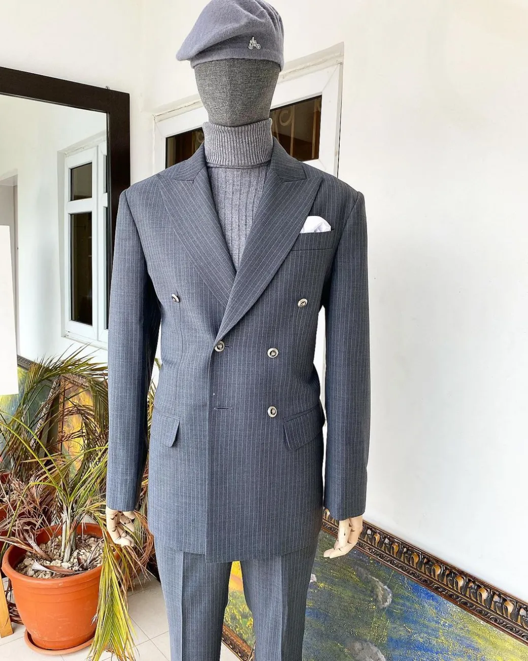 A Grey Pinstripe Peak Lapel Double Breasted Suit