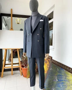 A Grey Pinstripe Peak Lapel Double Breasted Suit