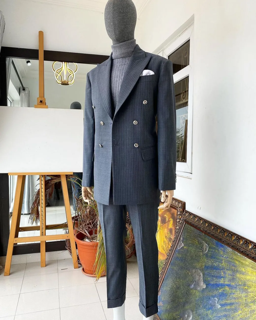 A Grey Pinstripe Peak Lapel Double Breasted Suit