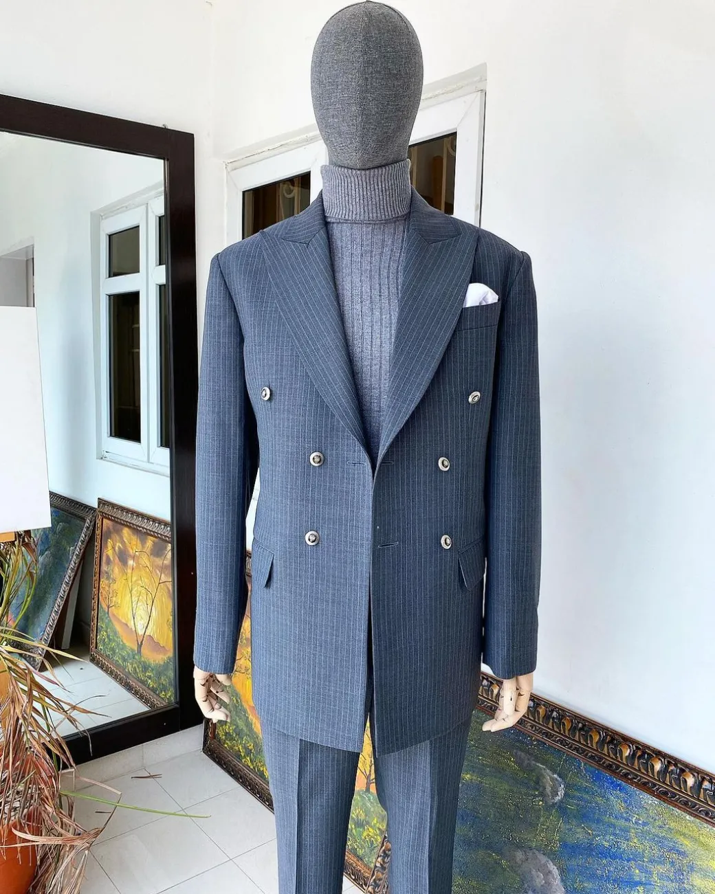 A Grey Pinstripe Peak Lapel Double Breasted Suit