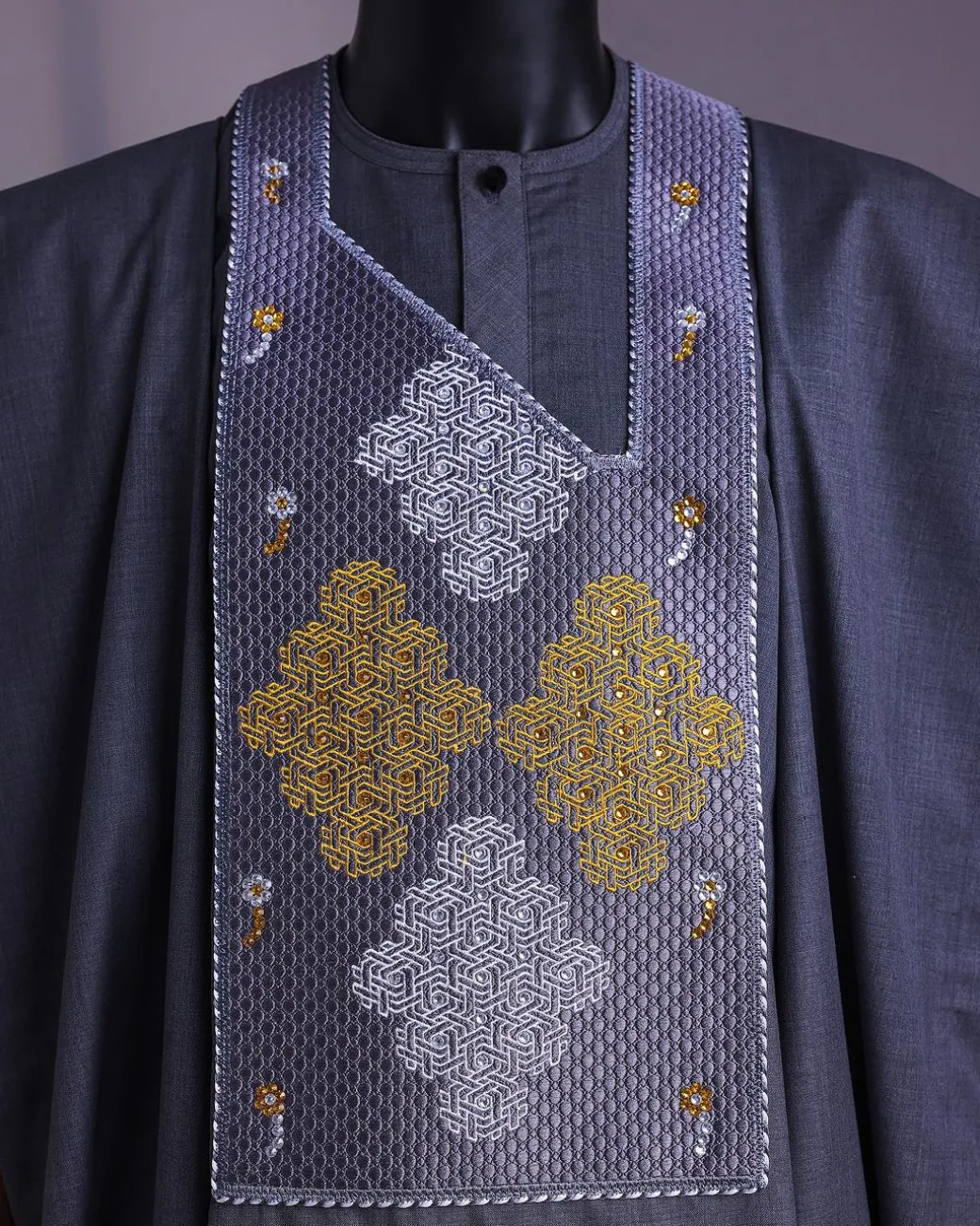 A Grey, Wooven Interconnected Square Details Agbada