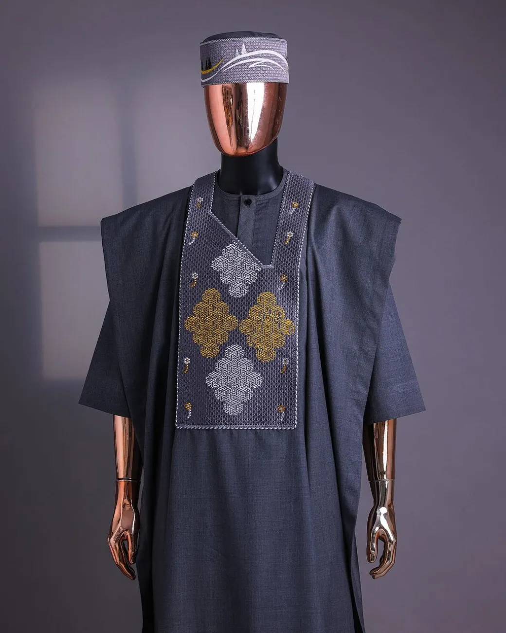 A Grey, Wooven Interconnected Square Details Agbada