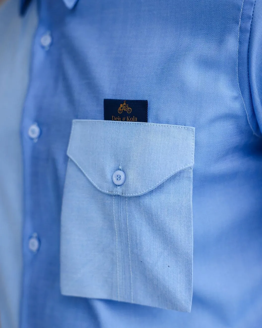 A Herringbone mix shade of blue English spread collar short sleeve casual shirt with double patch pocket.