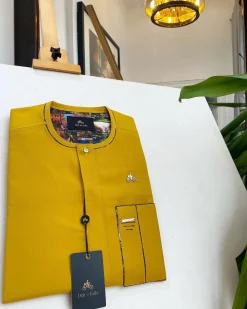 A honey yellow, clear view glass Swarovski buttons detailing African traditional senator kaftan native.