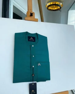 A Hunter green, flap with Swarovski button details, African traditional senator Kaftan native