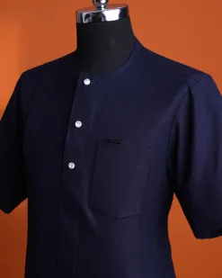 A Jorgecarli wool, midnight blue, invisible windowpane check, front flap with silver Swarovski button, shorts sleeve African senator kaftan native.