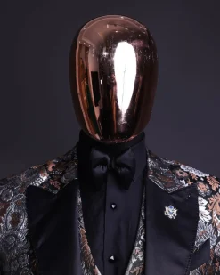 A knitted, brown, silver and black floral jacquard peak lapel suit
