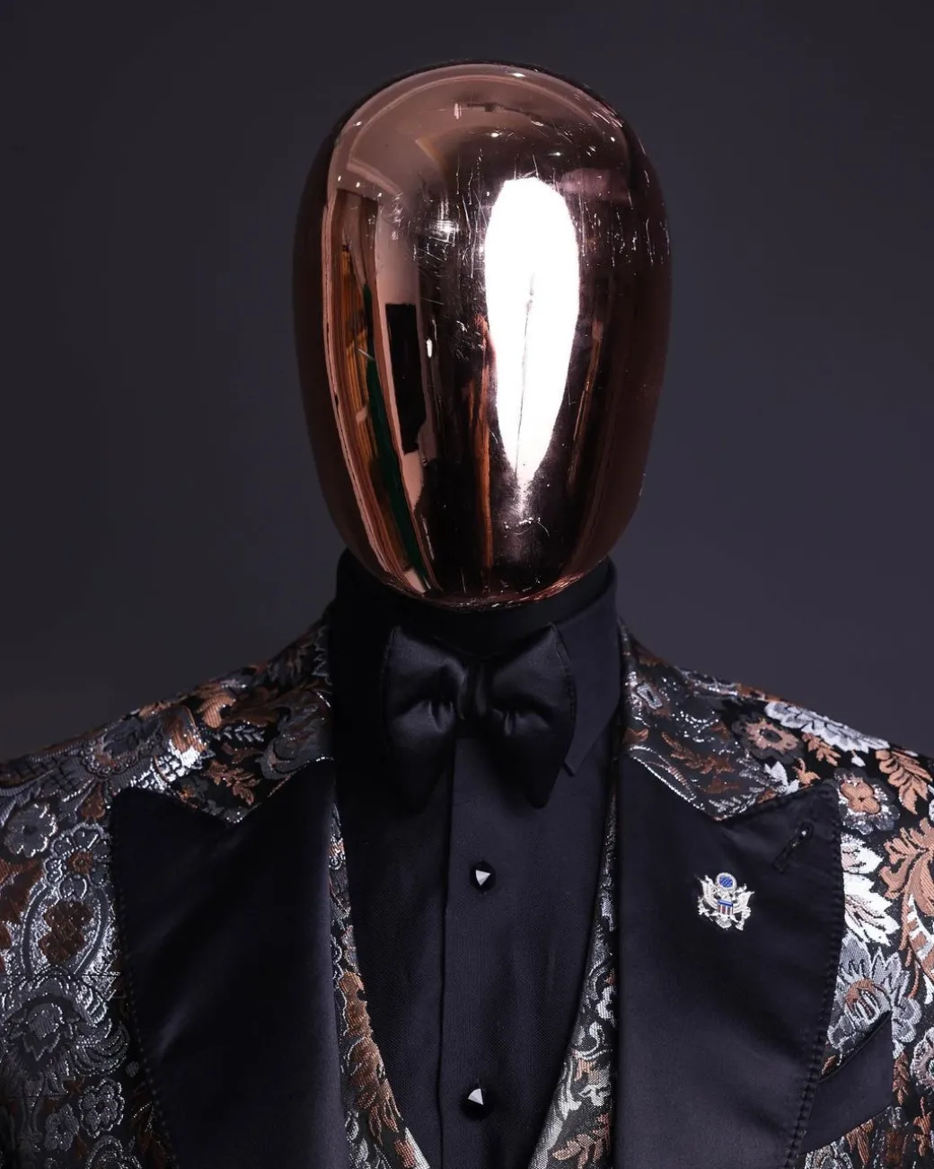 A knitted, brown, silver and black floral jacquard peak lapel suit
