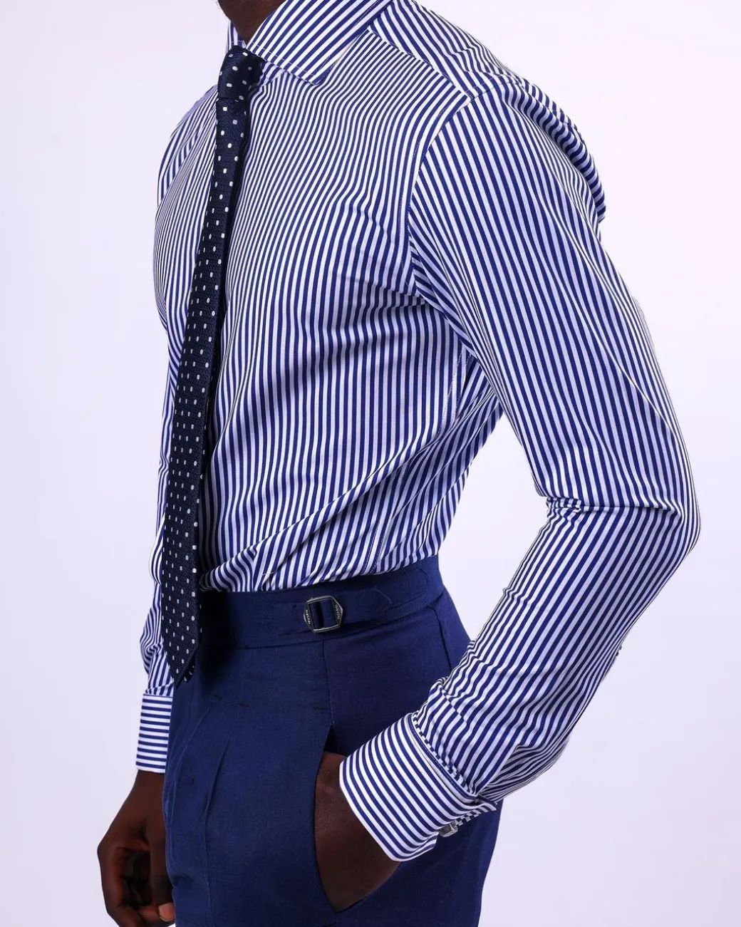 A knitted elastic, white and blue stripe shirt.