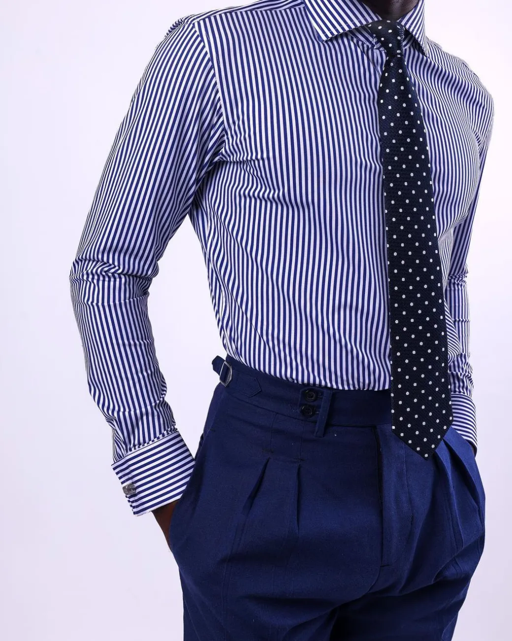 A knitted elastic, white and blue stripe shirt.