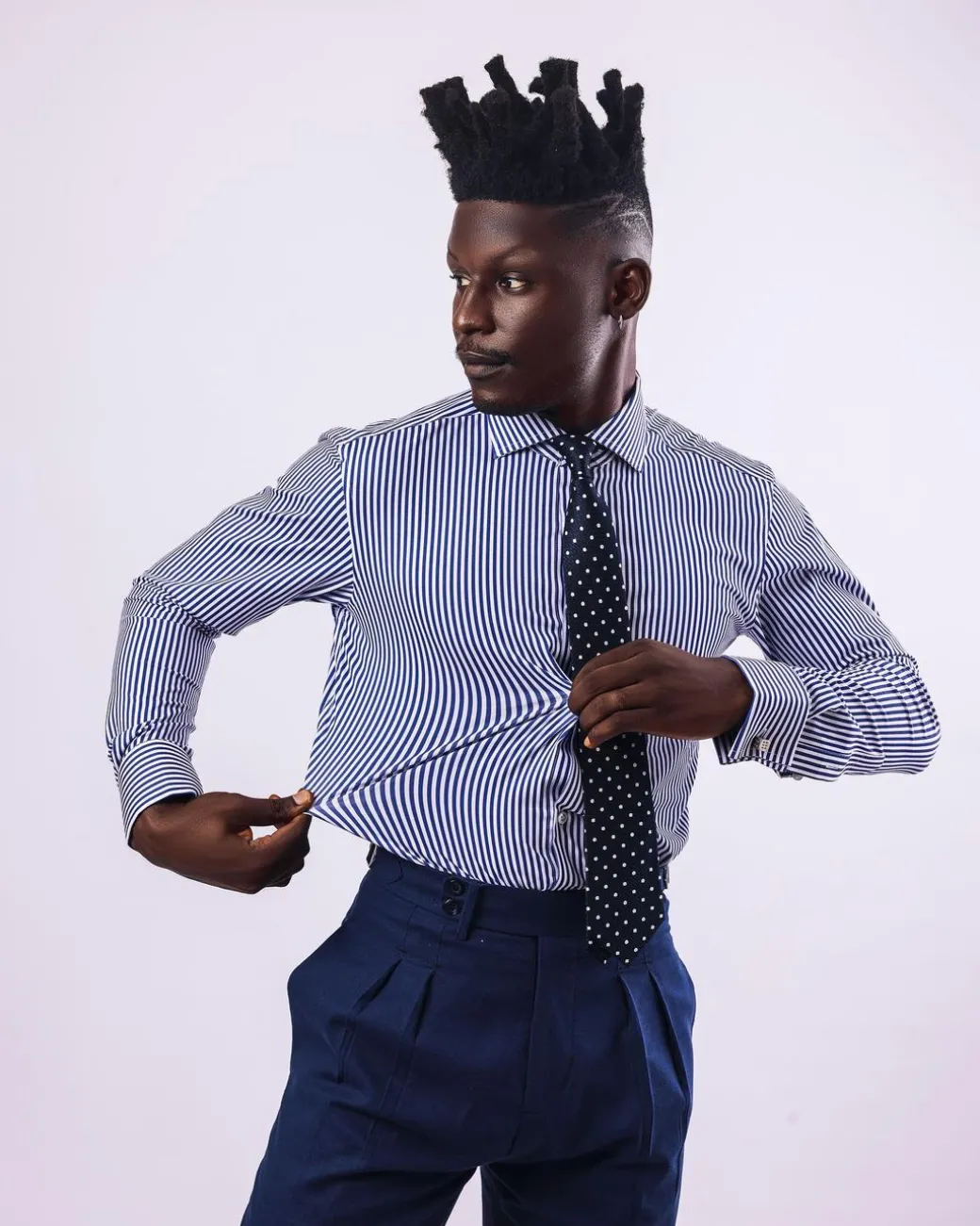 A knitted elastic, white and blue stripe shirt.