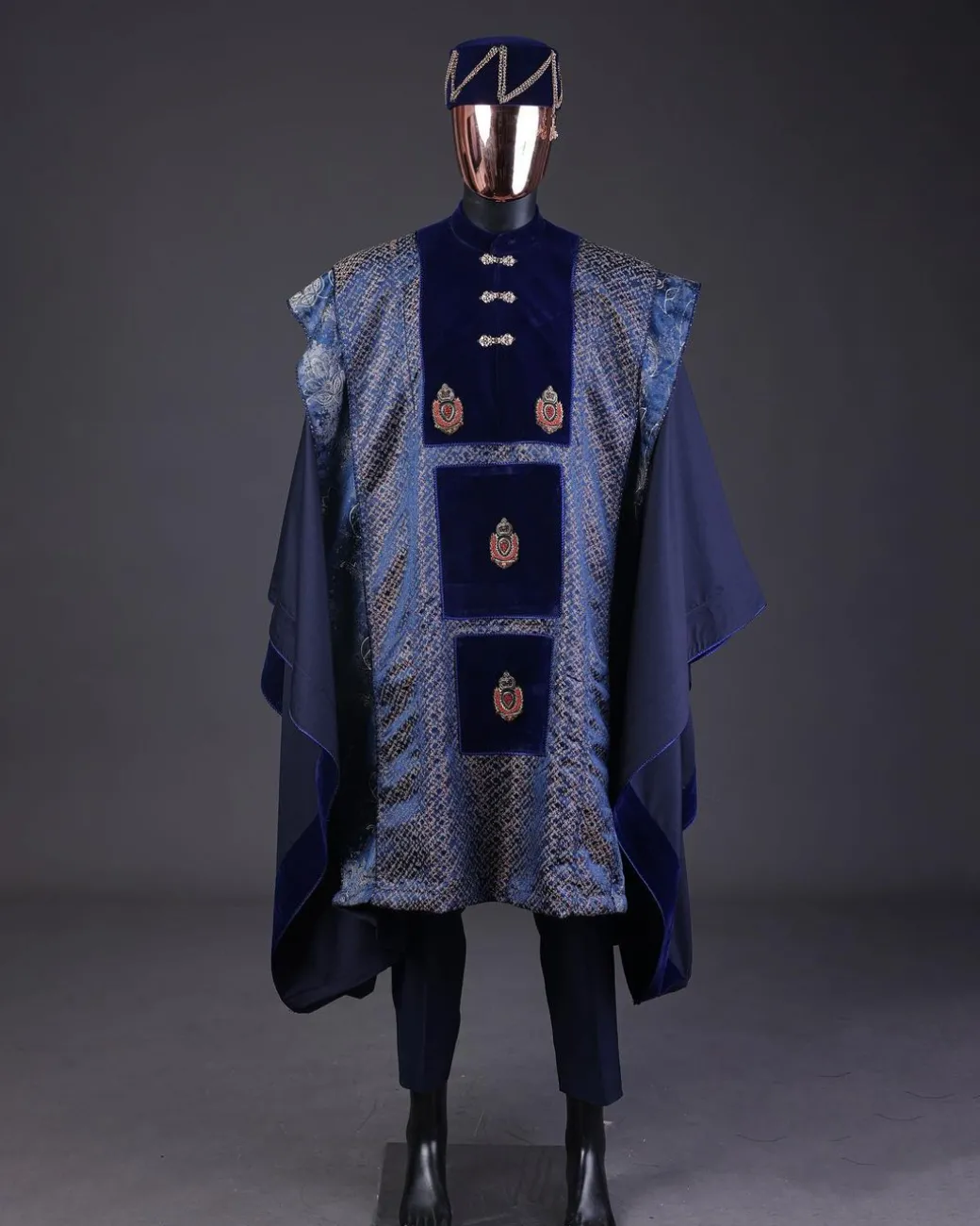 A “krosscut” layered, minted Gold, Skye, navy and admiral blue mix metallic jacquard front cut agbada.