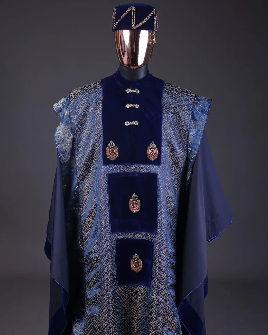 A “krosscut” layered, minted Gold, Skye, navy and admiral blue mix metallic jacquard front cut agbada.