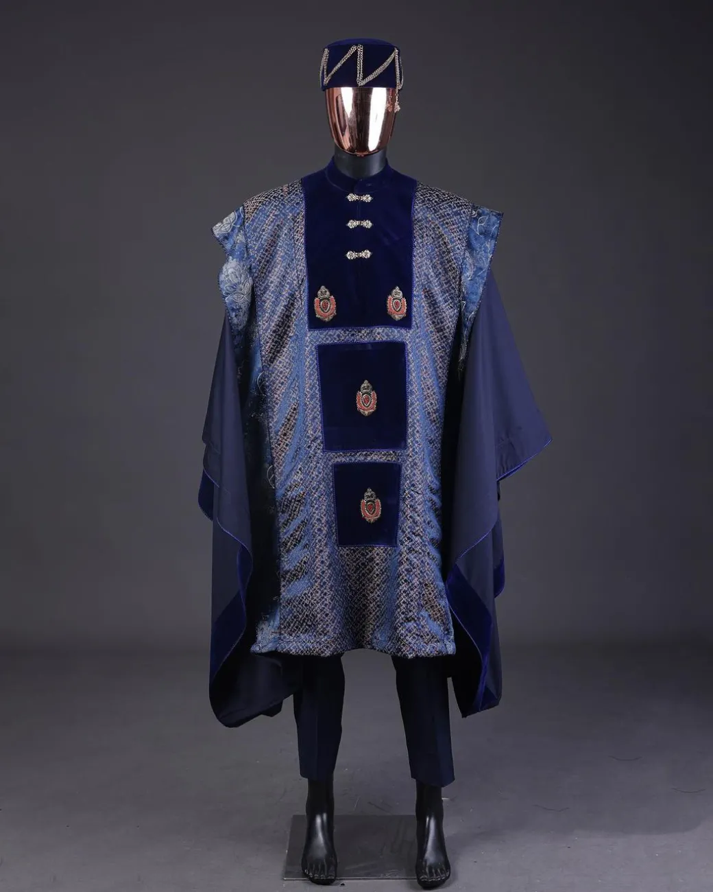 A “krosscut” layered, minted Gold, Skye, navy and admiral blue mix metallic jacquard front cut agbada.