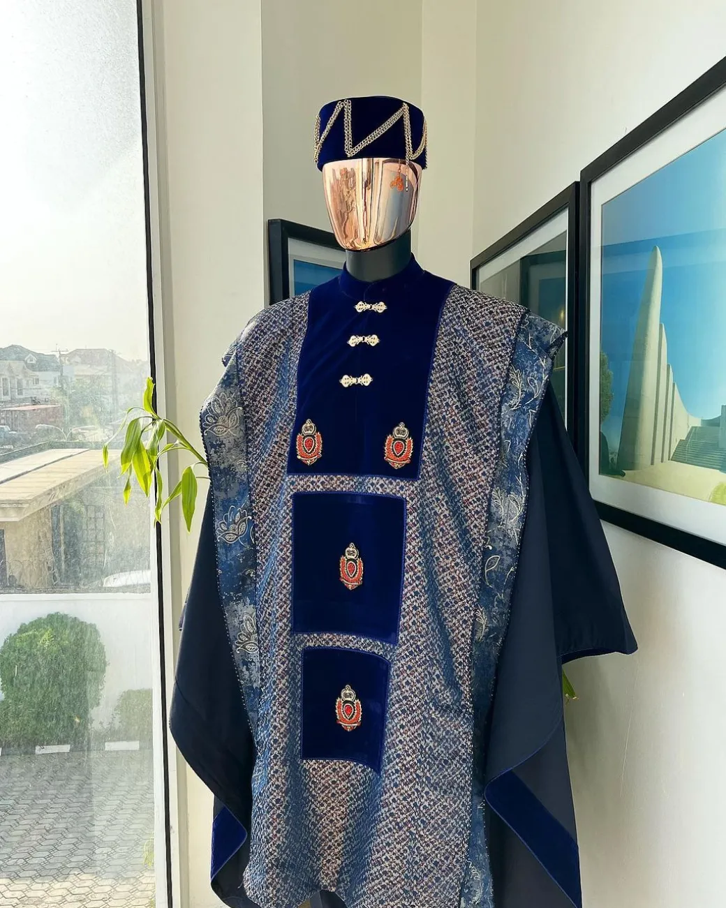 A “krosscut” layered, minted Gold, Skye, navy and admiral blue mix metallic jacquard front cut agbada.