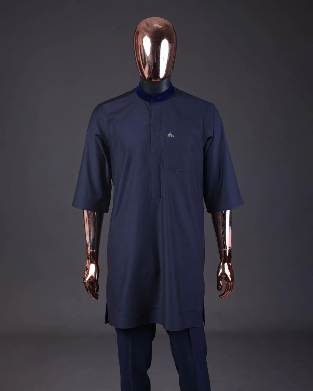 A “krosscut” layered, minted Gold, Skye, navy and admiral blue mix metallic jacquard front cut agbada.