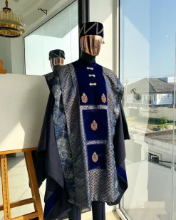 A “krosscut” layered, minted Gold, Skye, navy and admiral blue mix metallic jacquard front cut agbada.