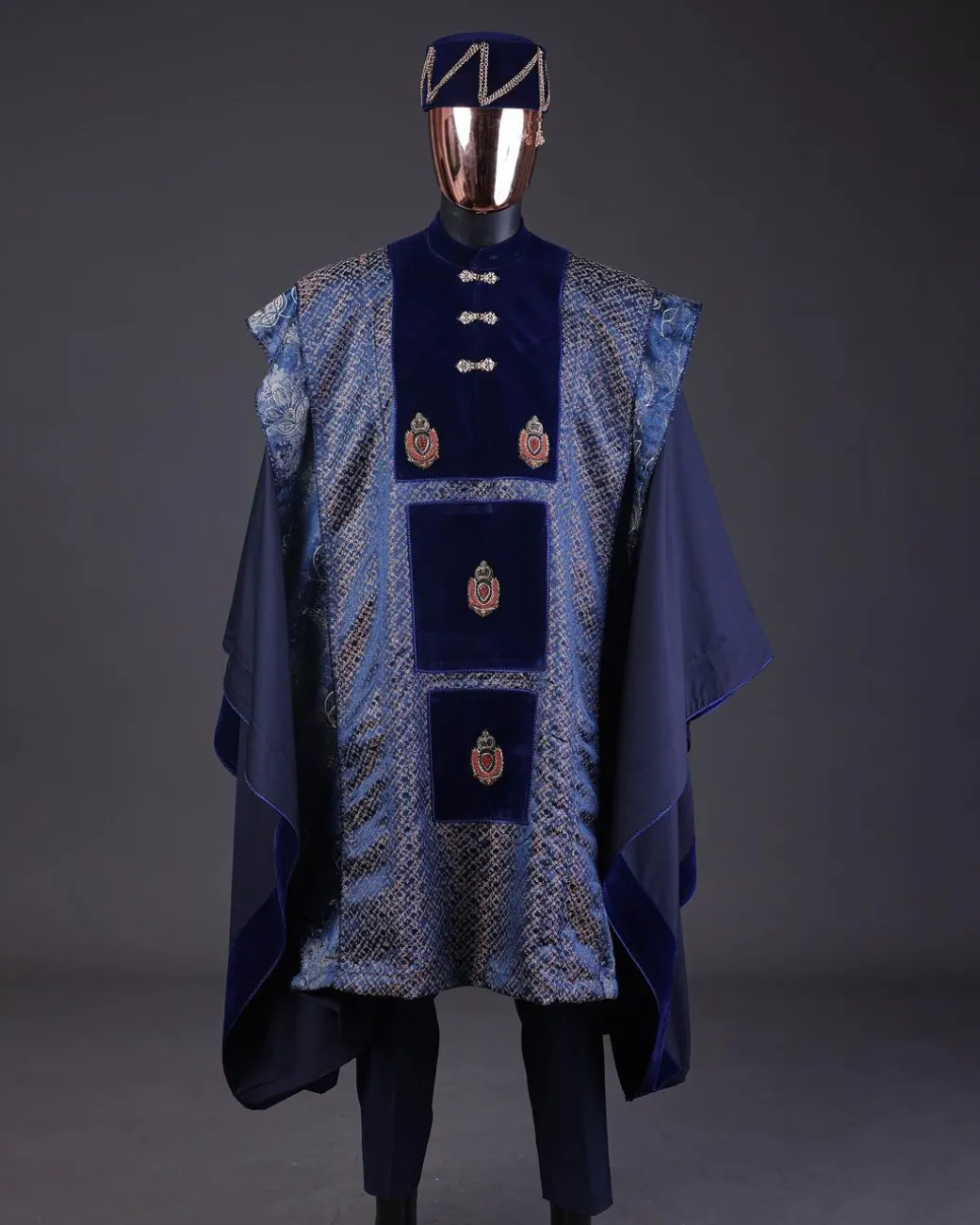 A “krosscut” layered, minted Gold, Skye, navy and admiral blue mix metallic jacquard front cut agbada.