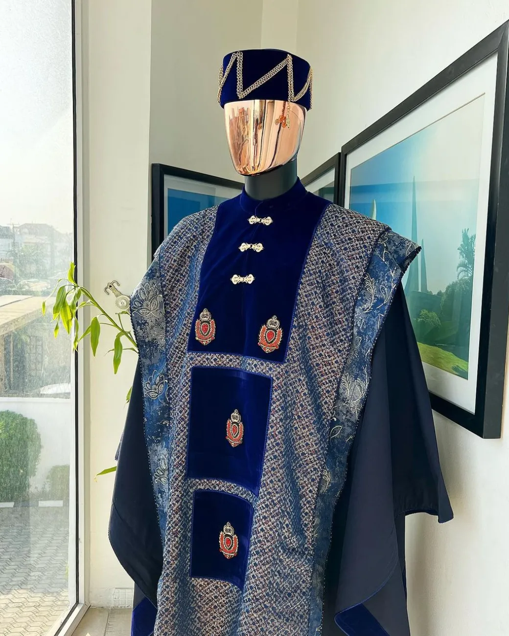A “krosscut” layered, minted Gold, Skye, navy and admiral blue mix metallic jacquard front cut agbada.