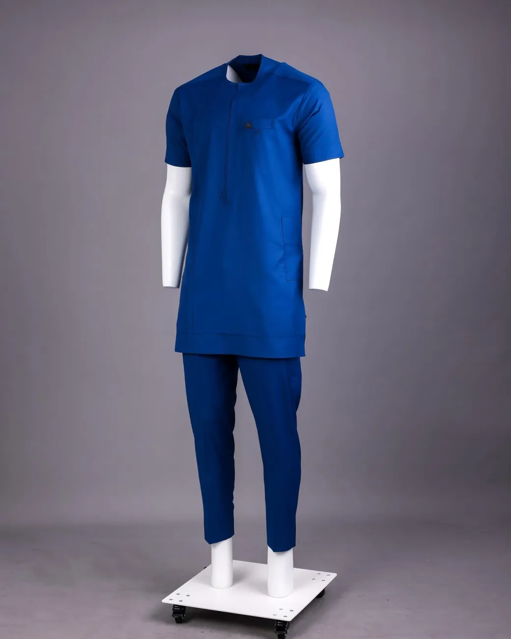 A Lapis Blue, Zipline with connected square and triangle bar-tacking details, short sleeve African senator Kaftan native.