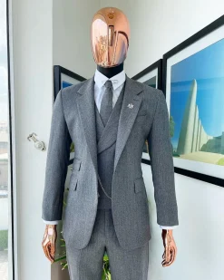 A Lava Grey, herringbone-patterned fabric Jorgecarli Super 140’s “Board Room” notch lapel suit