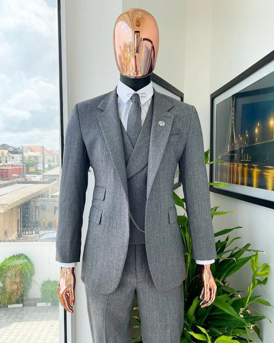 A Lava Grey, herringbone-patterned fabric Jorgecarli Super 140’s “Board Room” notch lapel suit