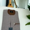 A Light and dark brown check, front flap and sliding pocket details African traditional kaftan native.
