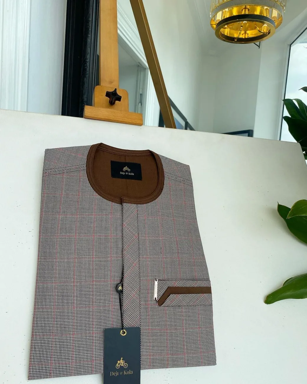A Light and dark brown check, front flap and sliding pocket details African traditional kaftan native.