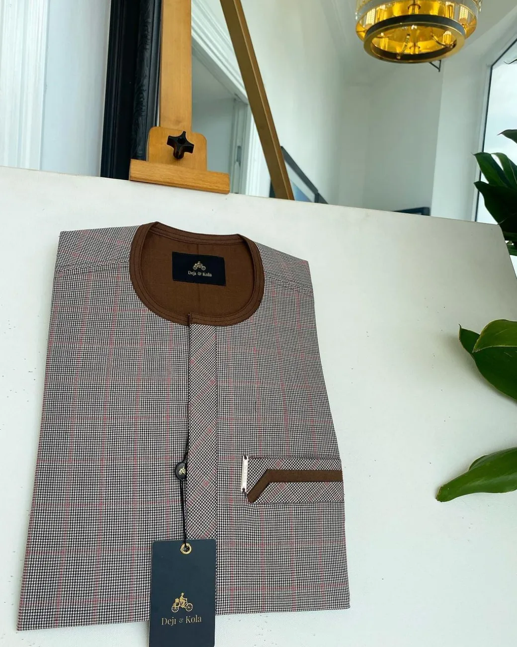 A Light and dark brown check, front flap and sliding pocket details African traditional kaftan native.