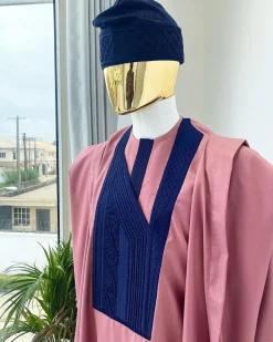 A light beige agbada with a navy blue uncoordinated lines embroidery design, Yoruba embroidery hat, kaftan and sokoto