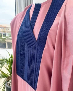 A light beige agbada with a navy blue uncoordinated lines embroidery design, Yoruba embroidery hat, kaftan and sokoto