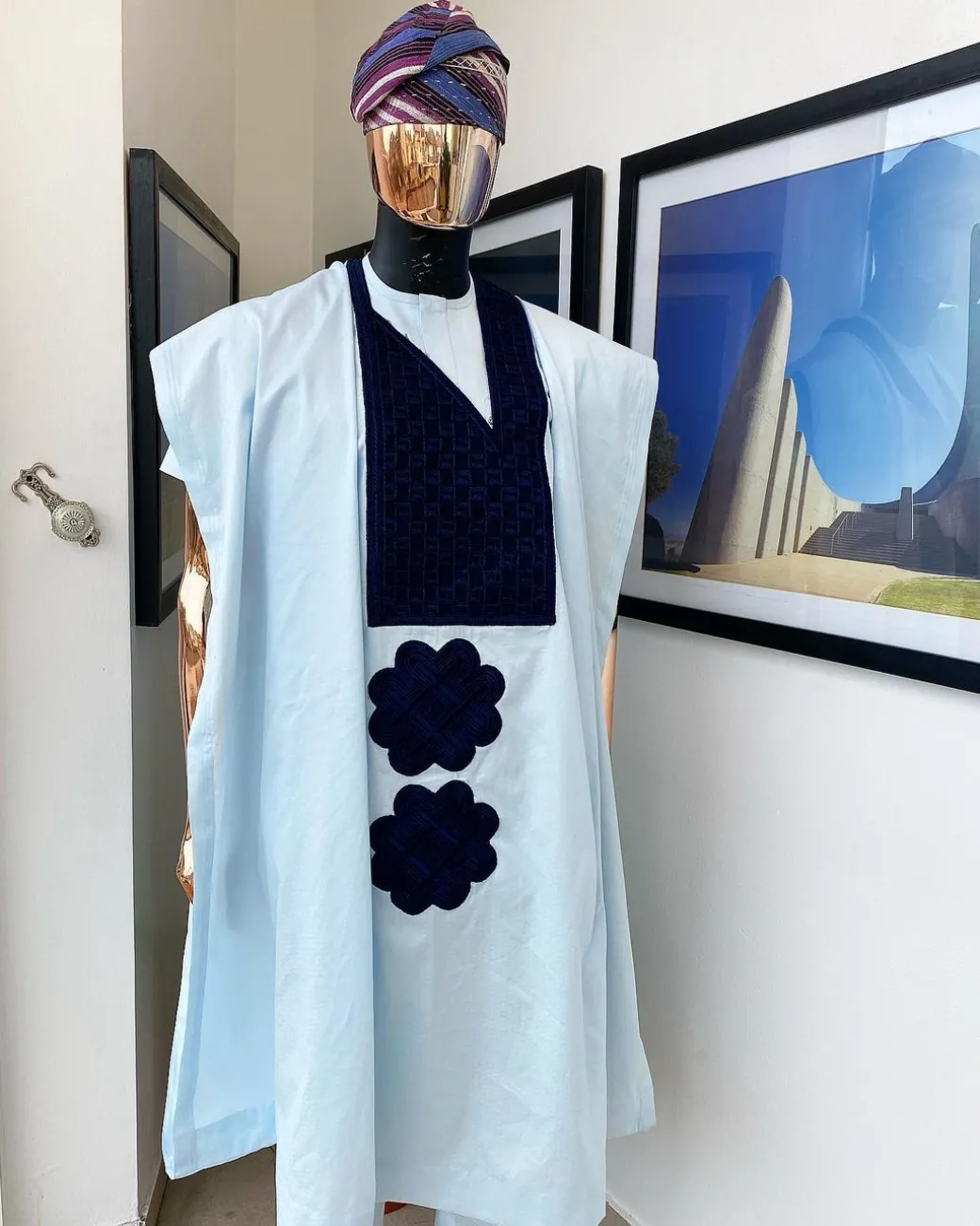 A Light blue, connected square navy blue embroidery Agbada