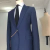 A Light Blue, Peak Lapel, One Button Tailored Suit with Gold Detailing