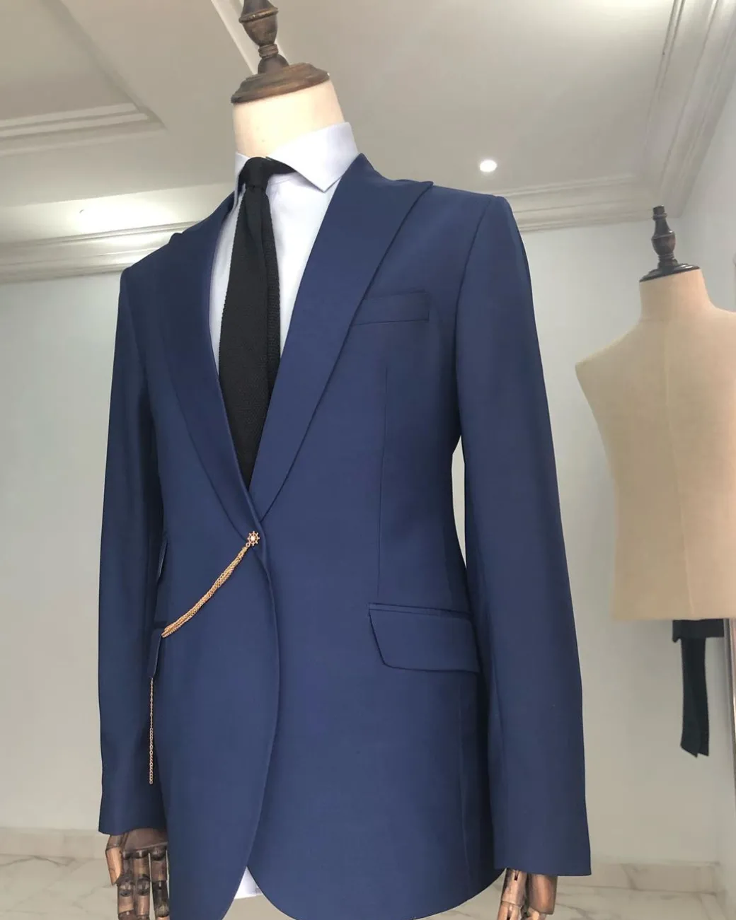 A Light Blue, Peak Lapel, One Button Tailored Suit with Gold Detailing
