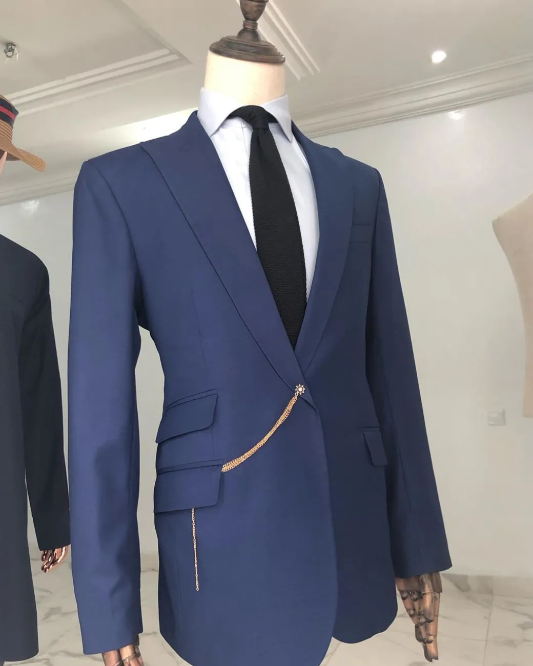 A Light Blue, Peak Lapel, One Button Tailored Suit with Gold Detailing