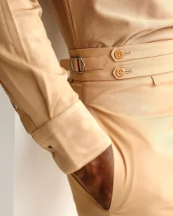 A Light brown Gurkha Pant With A Side Metal Adjuster.