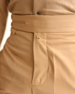 A Light brown Gurkha Pant With A Side Metal Adjuster.