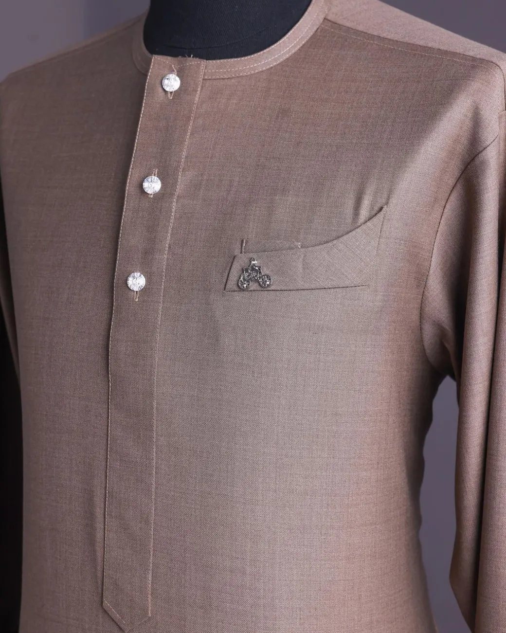 A Light brown, jorgecarli fabric, front flap with silver Swarovski button, long sleeve African senator kaftan native.
